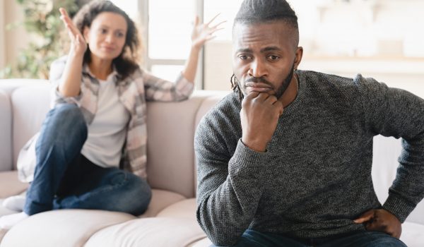 African wife and husband arguing crying misunderstanding between partners.Marriage problems, abuse, cheating. Spouses couple divorce. Psychology therapy. Scandal